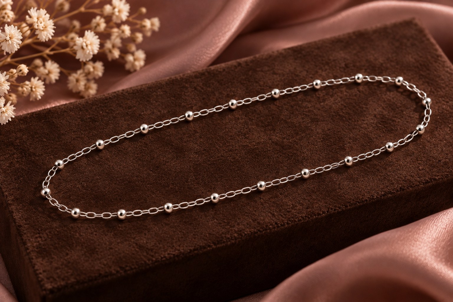 Sterling silver cable chain with small round silver beads on chocolate suede